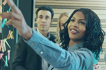 Lady leading a meeting with business men