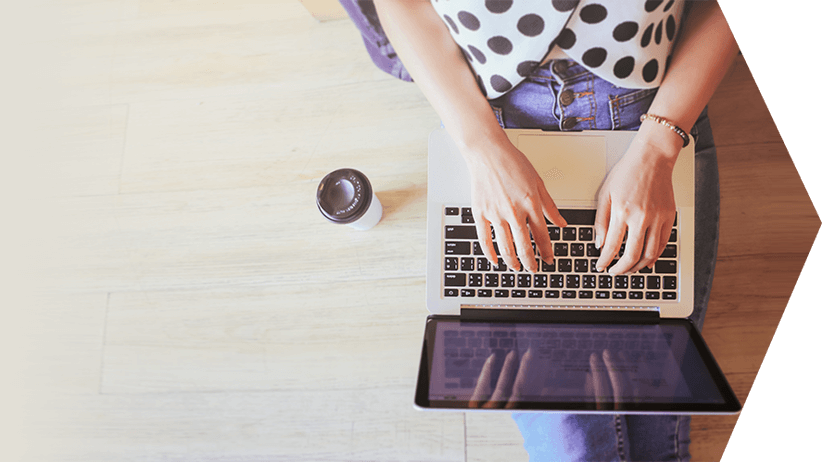 Closeup of a lady working on a laptop