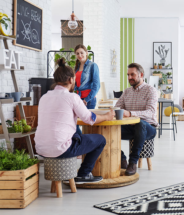 Employees sitting at table in office