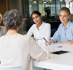 Businesswomen at boardroom meeting