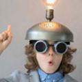 Boy with lightbulb on his head