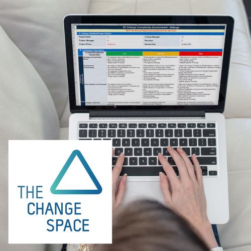 Lady using one of our change management template on her macbook