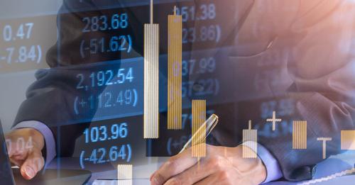 Concept of executive man at laptop managing finances