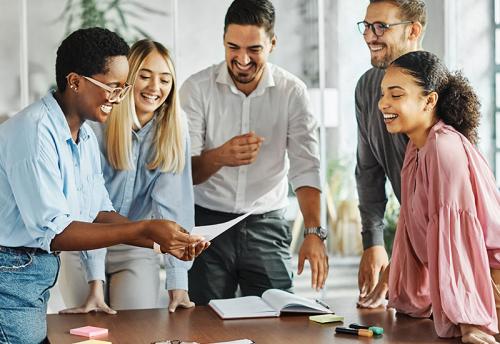 Professionals at desk being trained