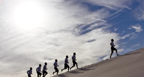 People walking up hill