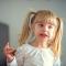 Young girl with a cheeky smile