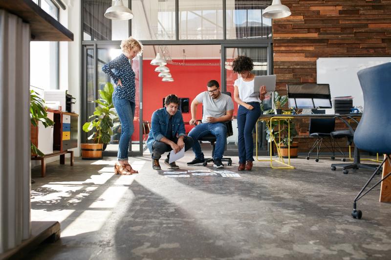 Workers discussing a challenge together