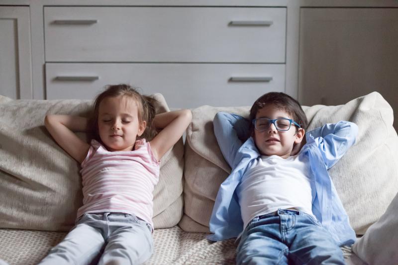 Kids chilling out on couch