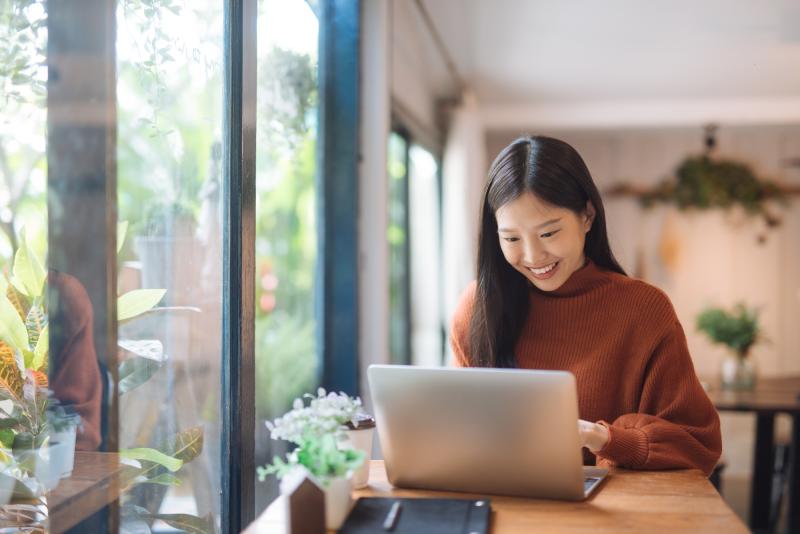 Asian lady working on laptop